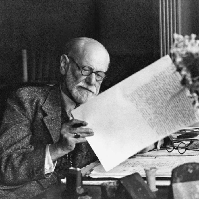 Sigmund Freud sat at desk