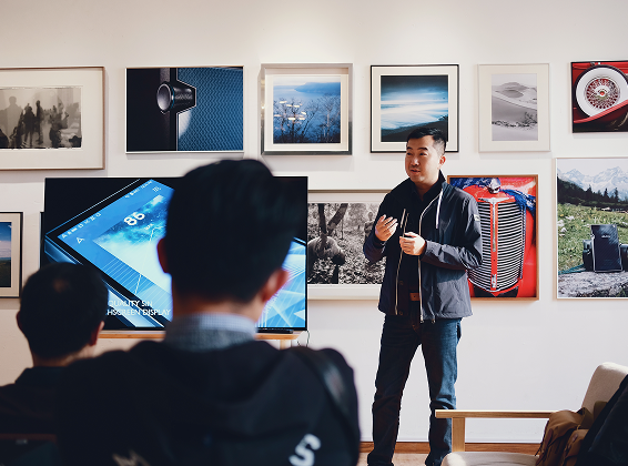 Man giving a lecture with two participants